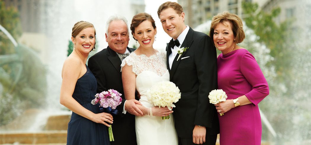 Bride and Groom with Family in Wedding portrait outside at Logan Square in Philadelphia, PA - Event Planning