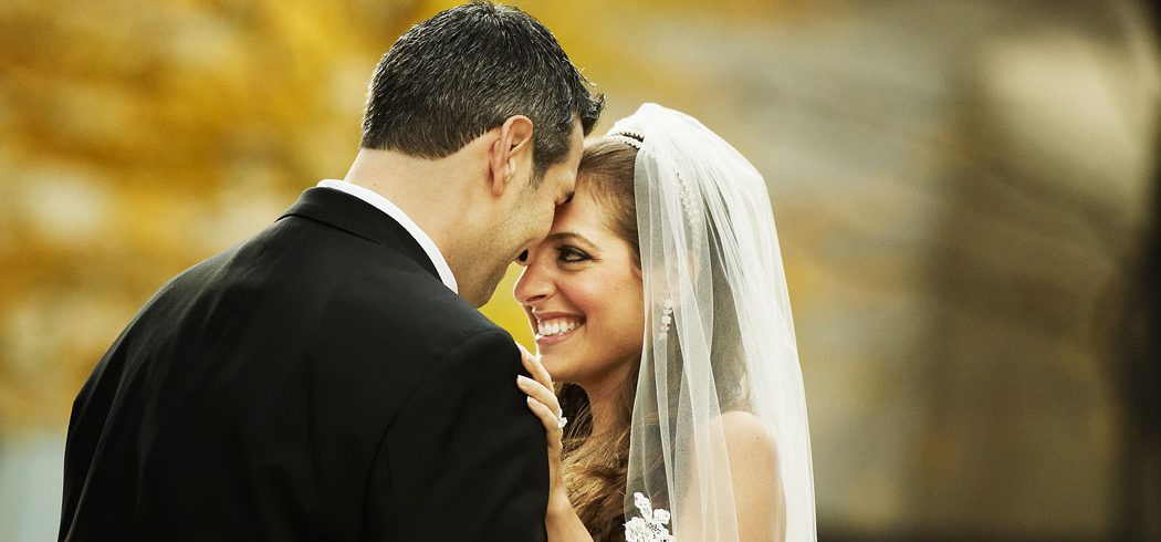 Bride and Groom laugh during outside wedding portraits in Philadelphia, PA - Event Planner