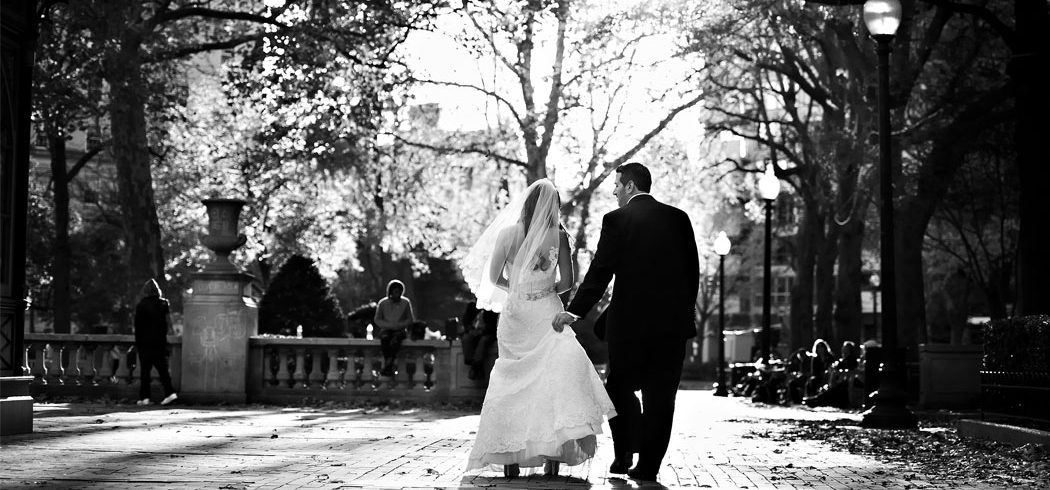 Bride and Groom walk away during outside wedding portraits in Philadelphia, PA - Event Planner