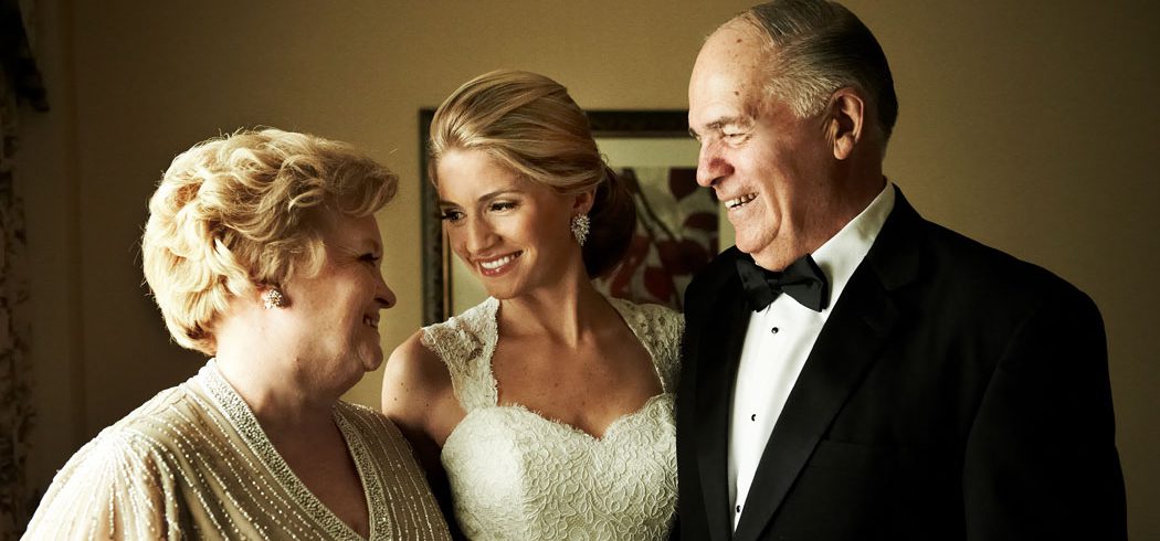 Bride smiling with parents while getting ready for wedding day in Philadelphia, PA - Event Planner