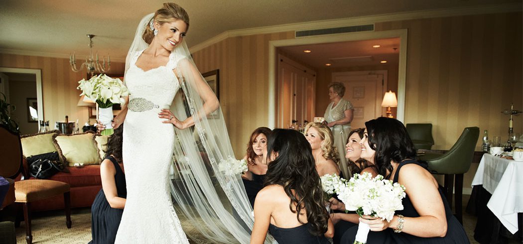 Bride with Bridesmaids putting on Wedding dress and veil in Philadelphia, PA - Event Planning