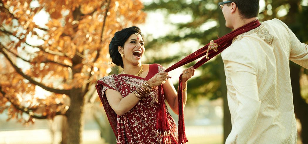 Bride and Groom joke around and laugh during outside wedding portraits in Philadelphia, PA - Event Planner