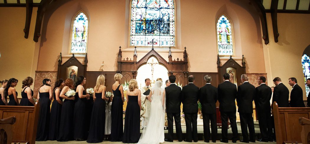 Bridal party at alter during wedding ceremony in Church in Philadelphia, PA - Event Planning