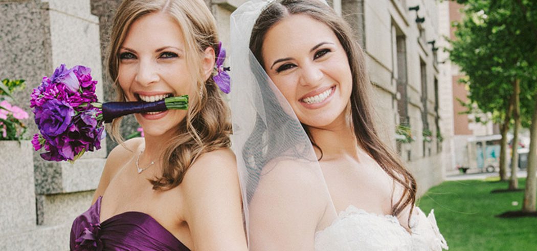 Bride with Maid of Honor smiling with flowers at wedding in Philadelphia, PA - Event Planning