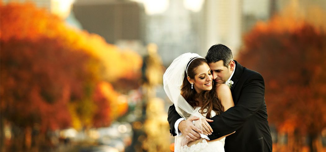 Bride and Groom embrace during outside wedding portraits in Philadelphia, PA - Event Planner