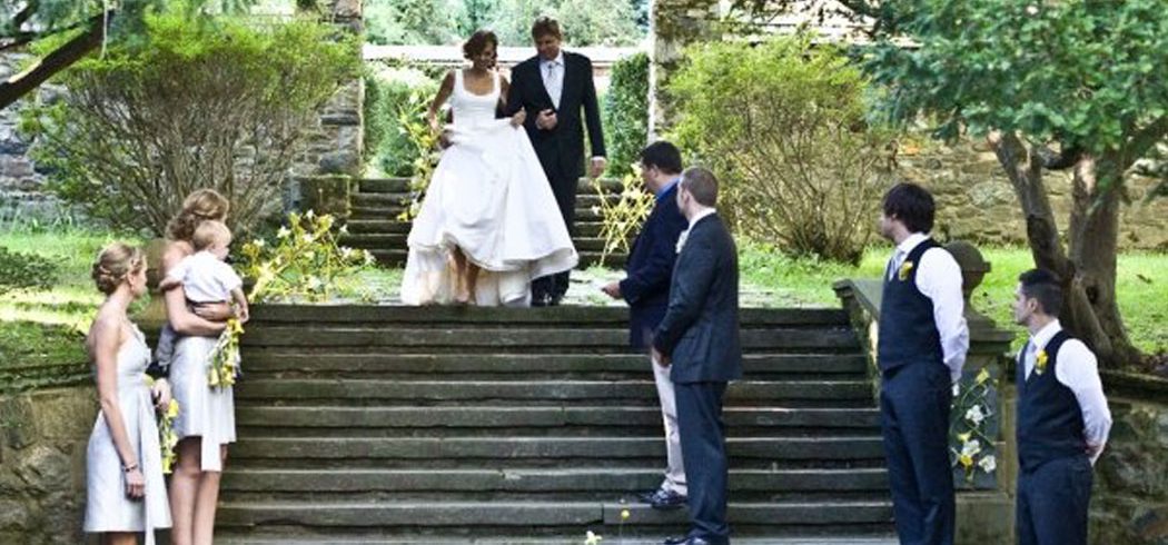 Bride and Father walk down aisle during wedding ceremony in Philadelphia, PA - Event Planner