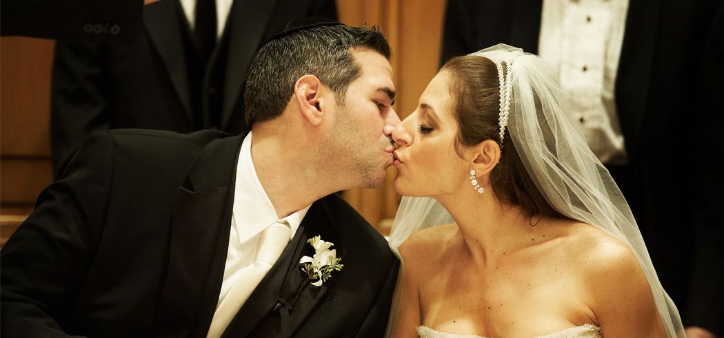 Bride and Groom kiss at wedding reception in Philadelphia, PA - Event Planner