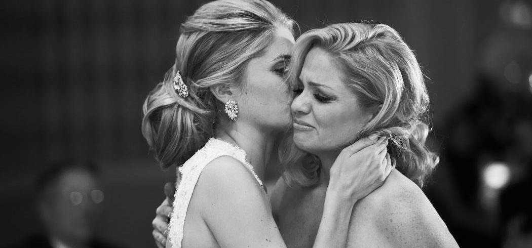 Brides and Maid of Honor embrace at wedding in Philadelphia, PA -Event Planning