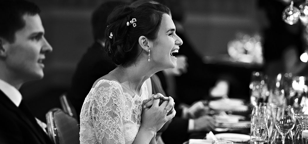 Bride laughing at wedding toast during wedding reception in Philadelphia, PA - Event Planner