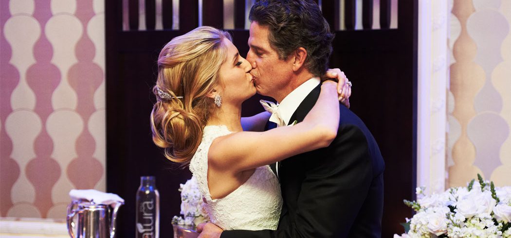 Bride and Groom kiss at wedding reception in Philadelphia, PA - Event Planner