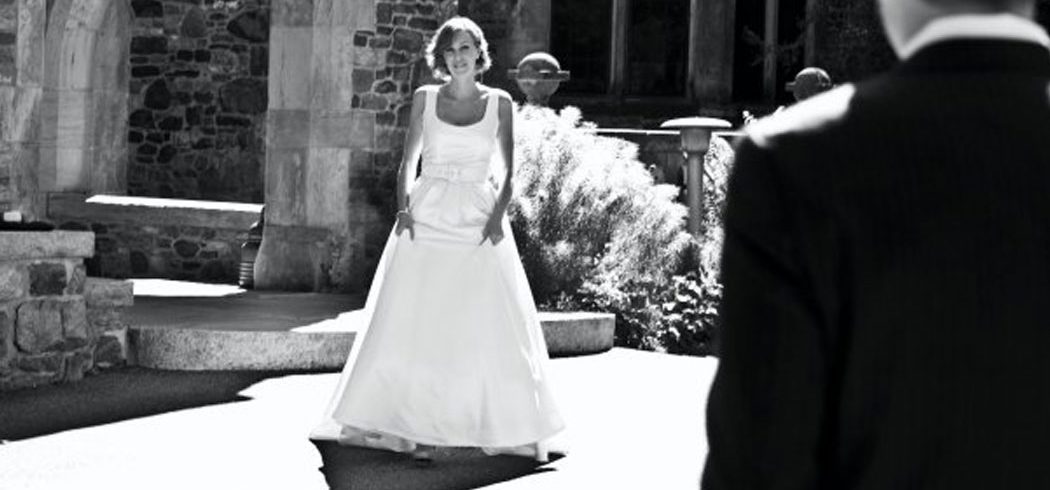 Bride smiling during first look outside wedding portraits in Philadelphia, PA - Event Planner