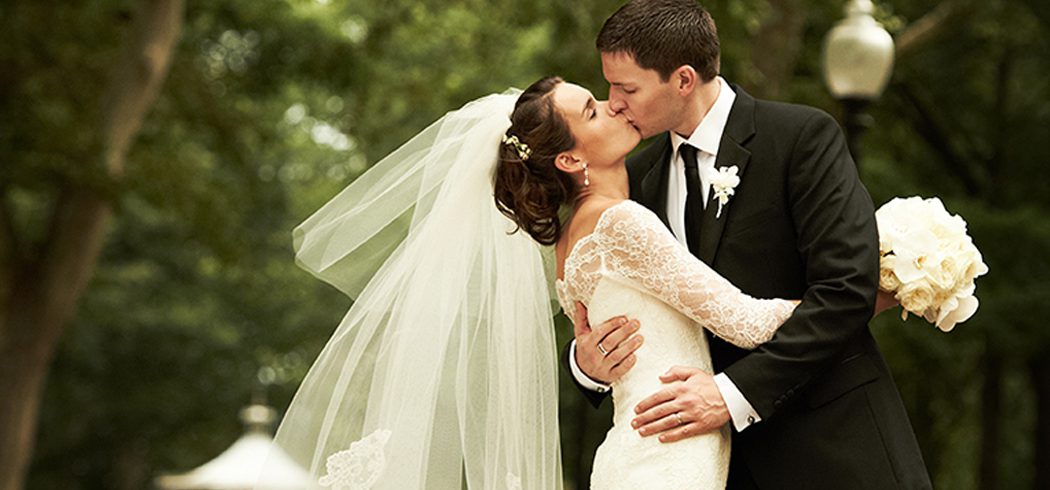 Bride and Groom kiss during outside wedding portraits in Philadelphia, PA - Event Planner